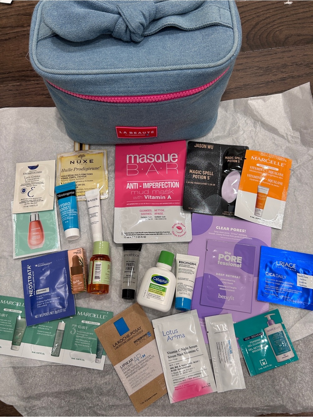 Blue Travel Cosmetic Bag with Assorted Women’s Skincare Masks and Samples